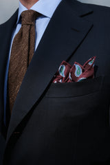 Side view of a model wearing the mustard plain silk shantung tie.