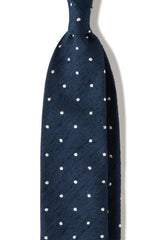 Navy polka dot shantung silk tie, shown from the front.