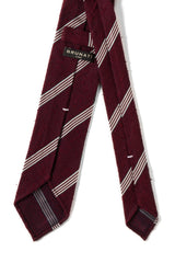 Bordeaux striped grenadine shantung silk tie, tied in a knot.