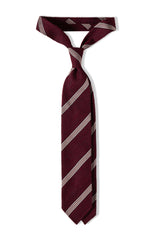 Bordeaux striped grenadine shantung silk tie, tied in a knot.