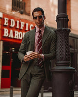 Model wearing the bordeaux striped grenadine shantung silk tie.