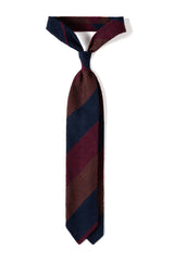 Bordeaux, navy and brown striped grenadine shantung silk tie, tied in a knot.