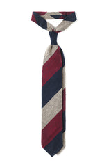 Burgundy, navy and beige striped grenadine shantung silk tie, tied in a knot.
