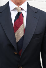 Model wearing the burgundy, navy and beige striped grenadine shantung silk tie.