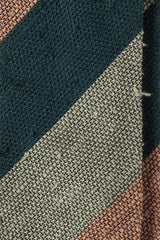 Close-up of the grenadine shantung silk texture with green, beige and mustard stripes.