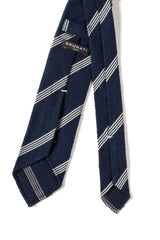 Back view of the navy and white striped grenadine shantung silk tie with hand-rolled edges.