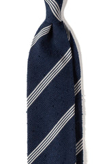 Navy and white striped grenadine shantung silk tie, shown from the front.