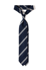 Navy and white striped grenadine shantung silk tie, tied in a knot.