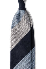 Navy, white and light blue striped grenadine shantung silk tie, shown from the front.