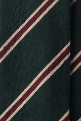 Close-up of the textured silk shantung fabric with forest, beige and burgundy stripes.