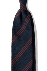 Navy and brown striped silk shantung tie, shown from the front.